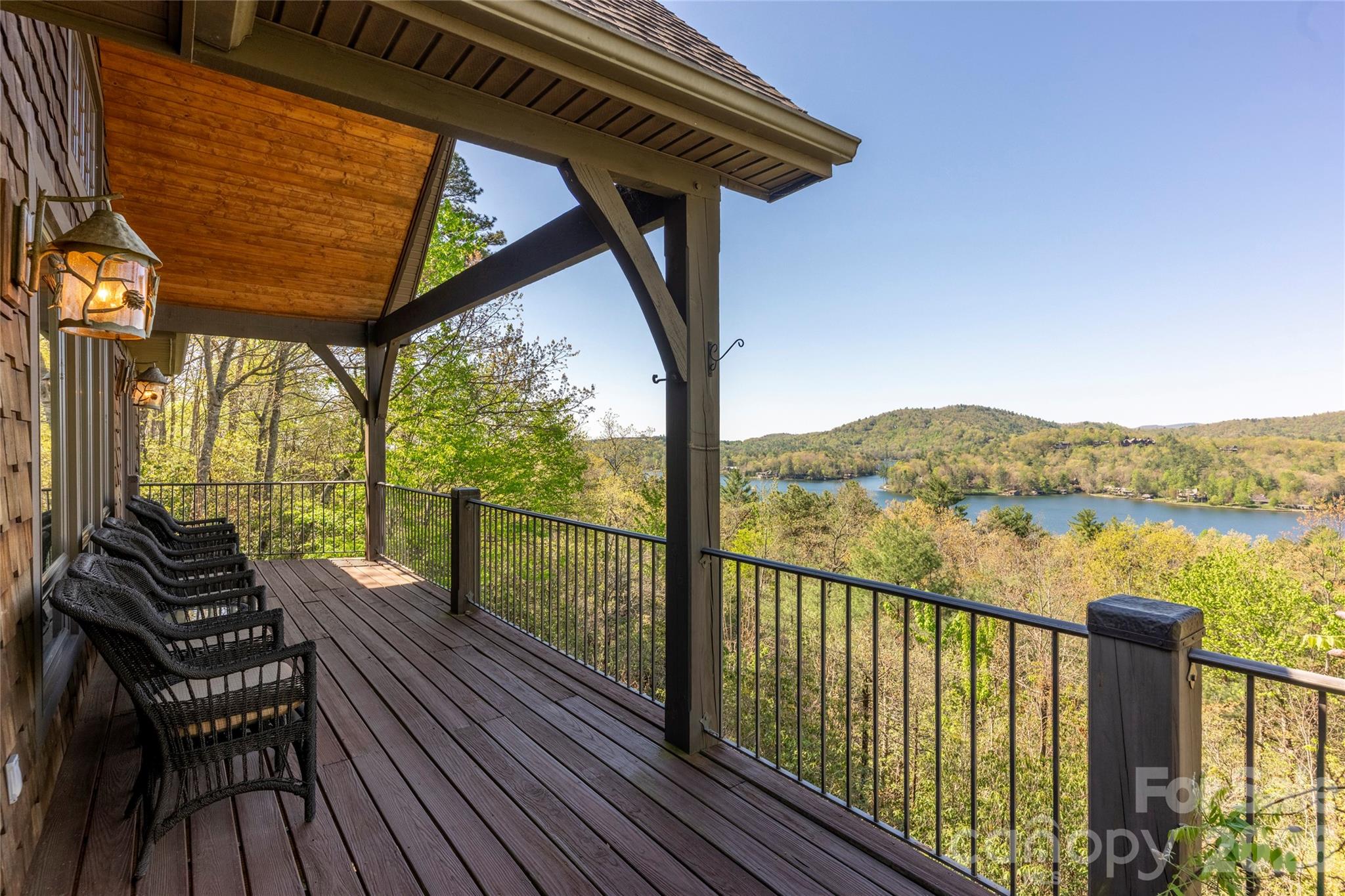 601 Hawk Mountain Road Lake Toxaway, NC 28747 - Photo 26 of 48 a view of a balcony with chairs and a table