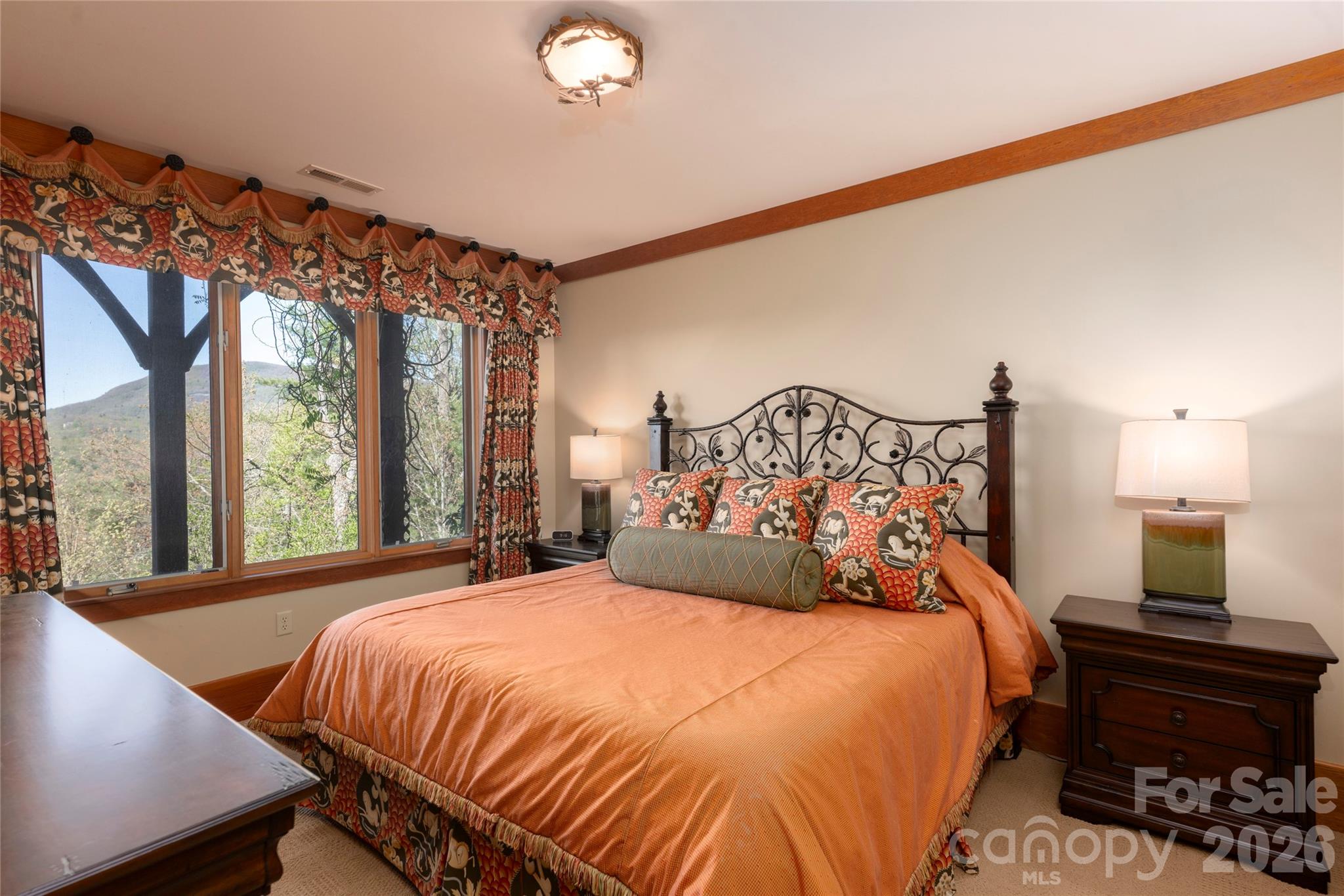 601 Hawk Mountain Road Lake Toxaway, NC 28747 - Photo 34 of 48 a bedroom with a large bed and a window