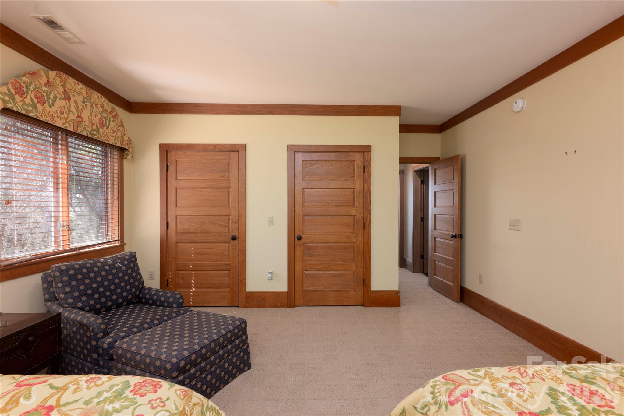 601 Hawk Mountain Road Lake Toxaway, NC 28747 - Photo 38 of 48 a bedroom with a bed and wooden floor
