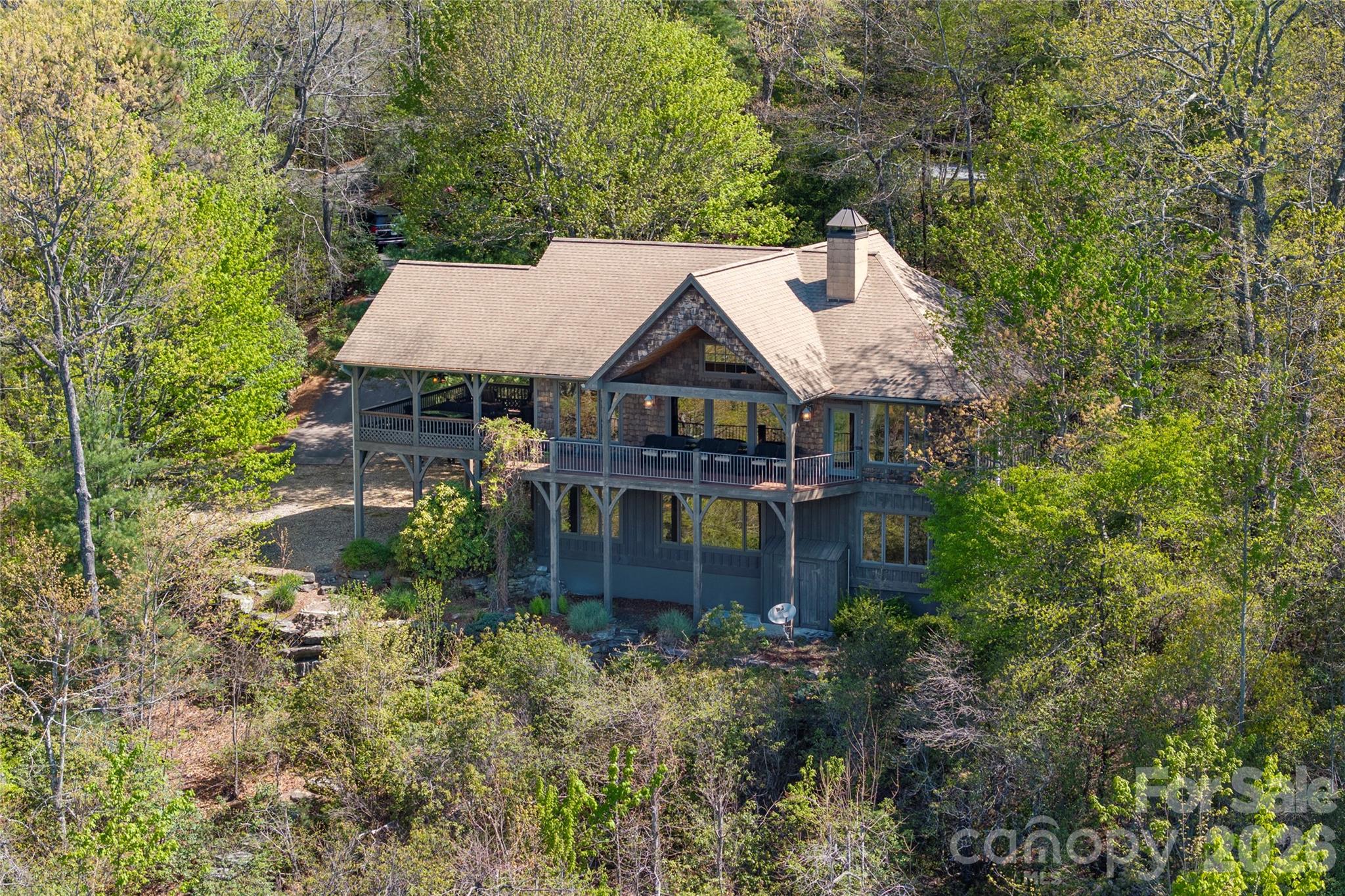 601 Hawk Mountain Road Lake Toxaway, NC 28747 - Photo 46 of 48 a aerial view of a house with a yard and sitting area