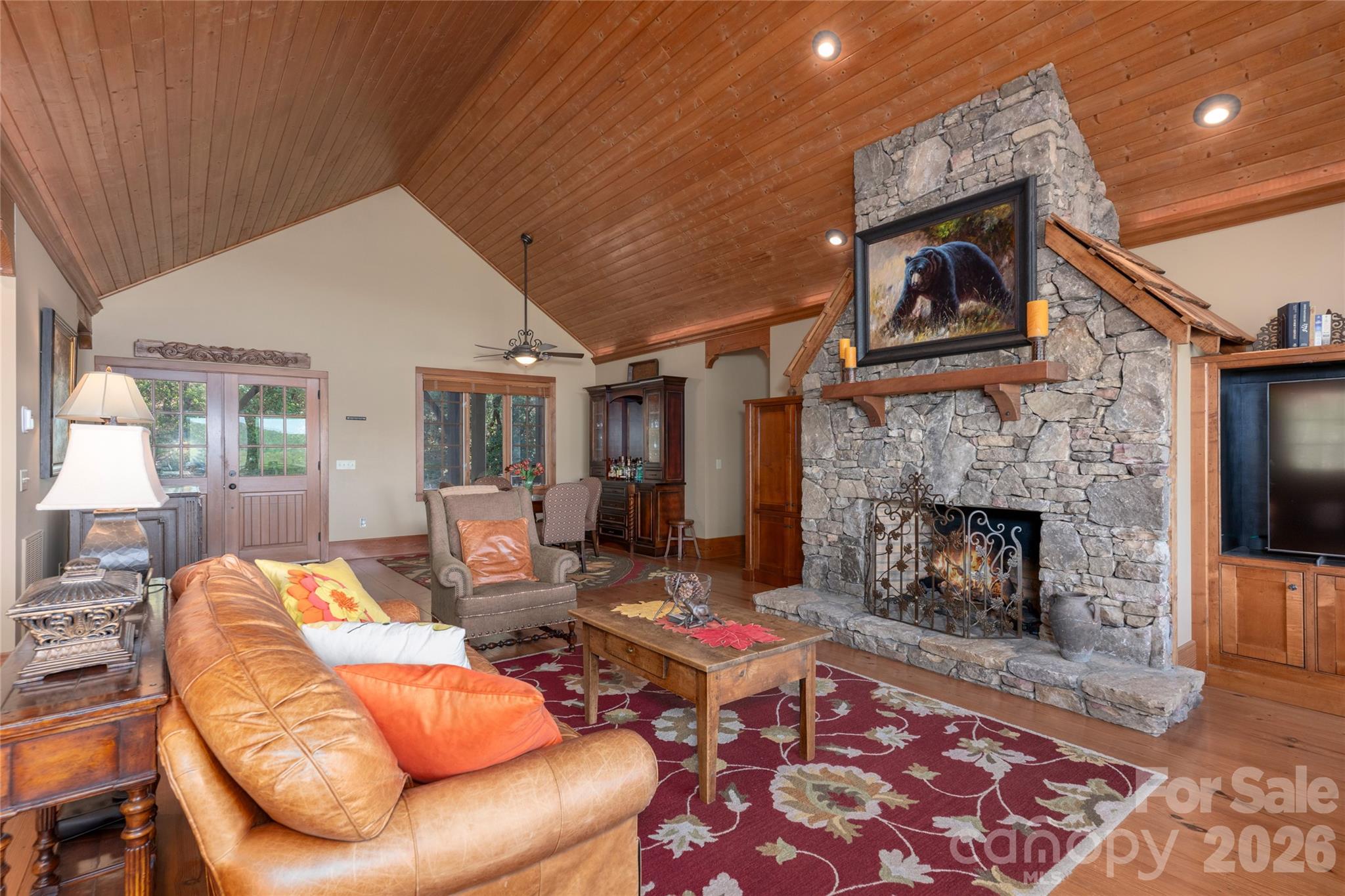 601 Hawk Mountain Road Lake Toxaway, NC 28747 - Photo 7 of 48 a living room with furniture and a fireplace