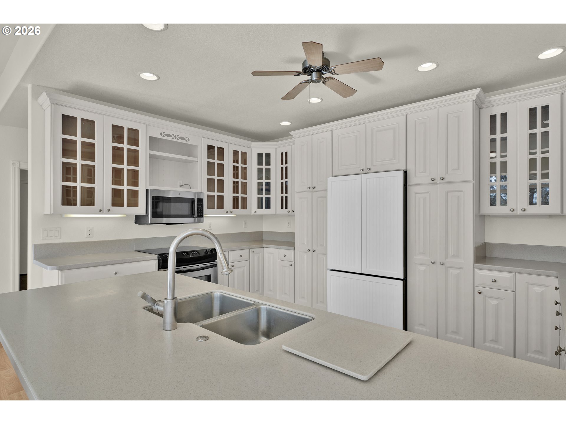 5816 Martin Road Florence, OR 97439 - Photo 18 of 47 a kitchen with a refrigerator and a sink