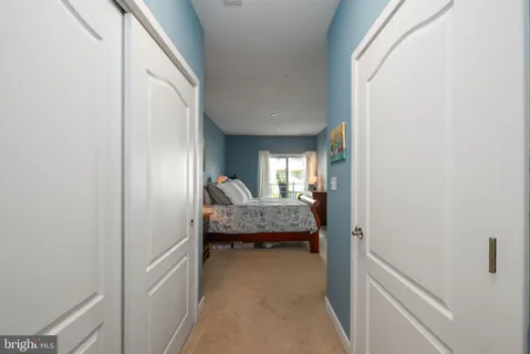 a bathroom with a granite countertop sink a large mirror and a window
