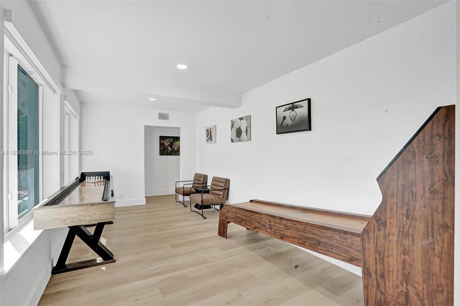 725 Harrison Street Hollywood, FL 33019 - Photo 28 of 91 a living room with furniture and a wooden floor