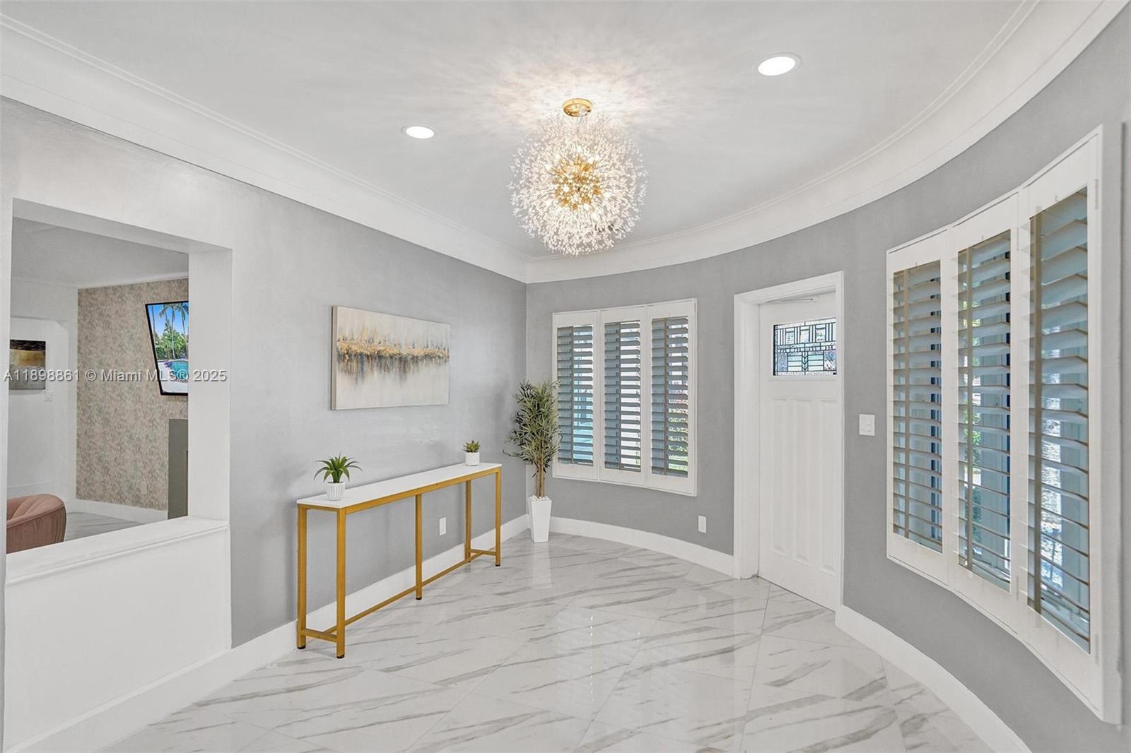 725 Harrison Street Hollywood, FL 33019 - Photo 3 of 91 a view of an empty room with a window