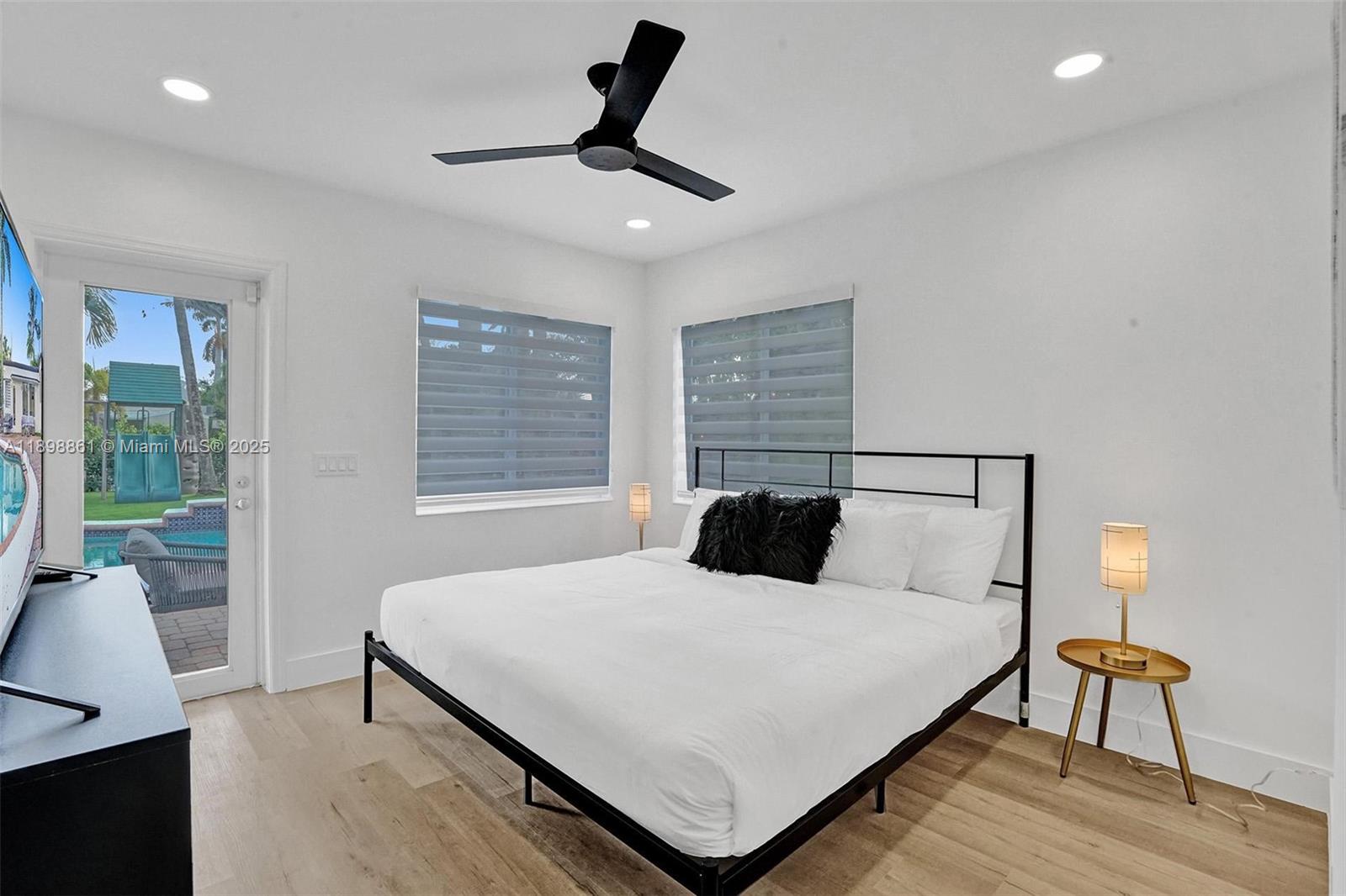 725 Harrison Street Hollywood, FL 33019 - Photo 31 of 91 a bedroom with a large bed and a window