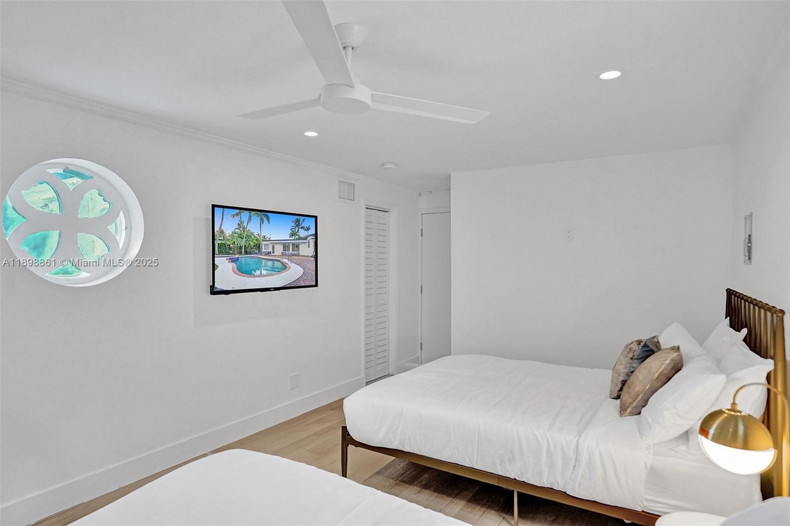 725 Harrison Street Hollywood, FL 33019 - Photo 33 of 91 a bedroom with a bed and a window