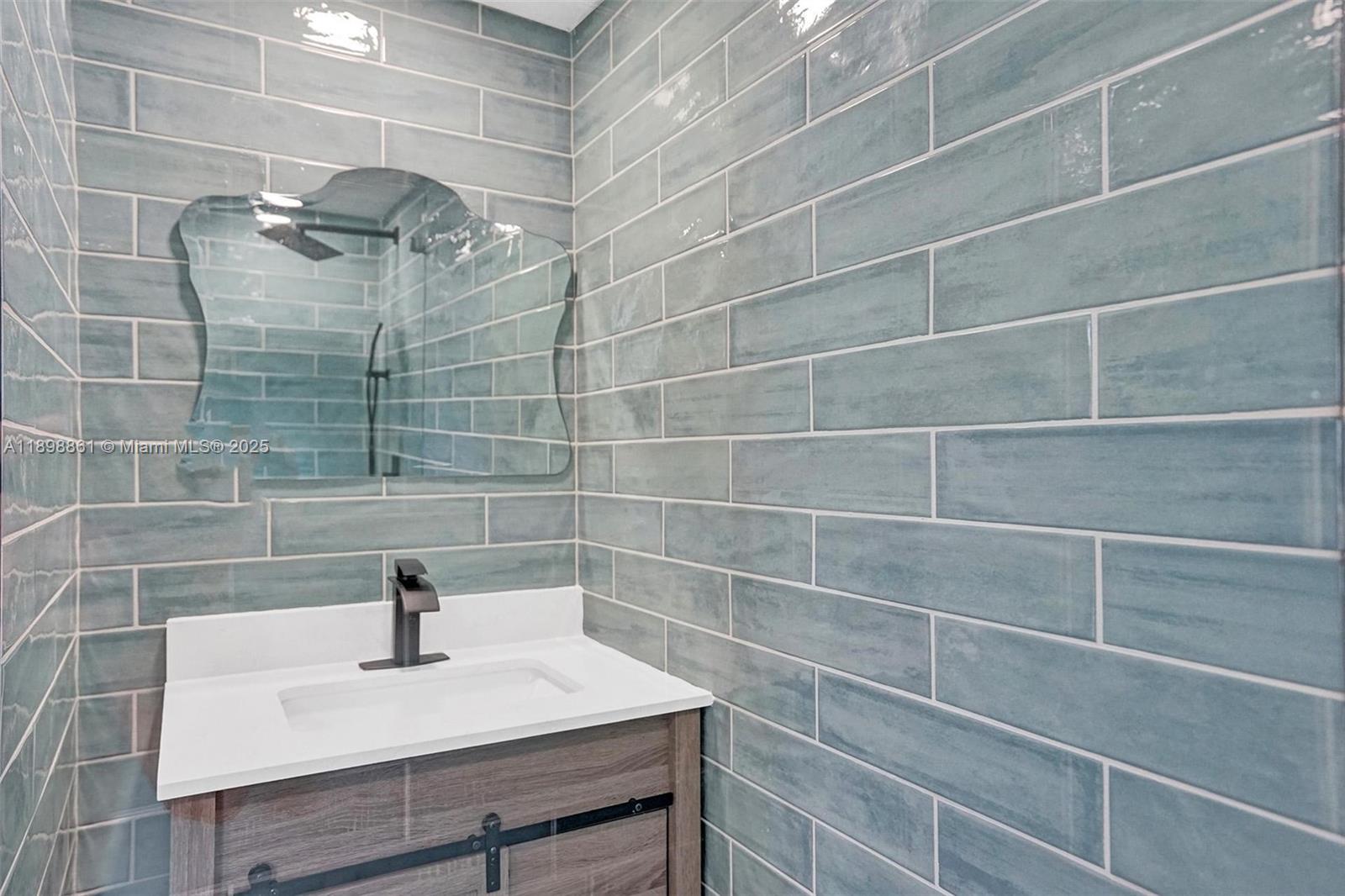 725 Harrison Street Hollywood, FL 33019 - Photo 50 of 91 a bathroom with a shower