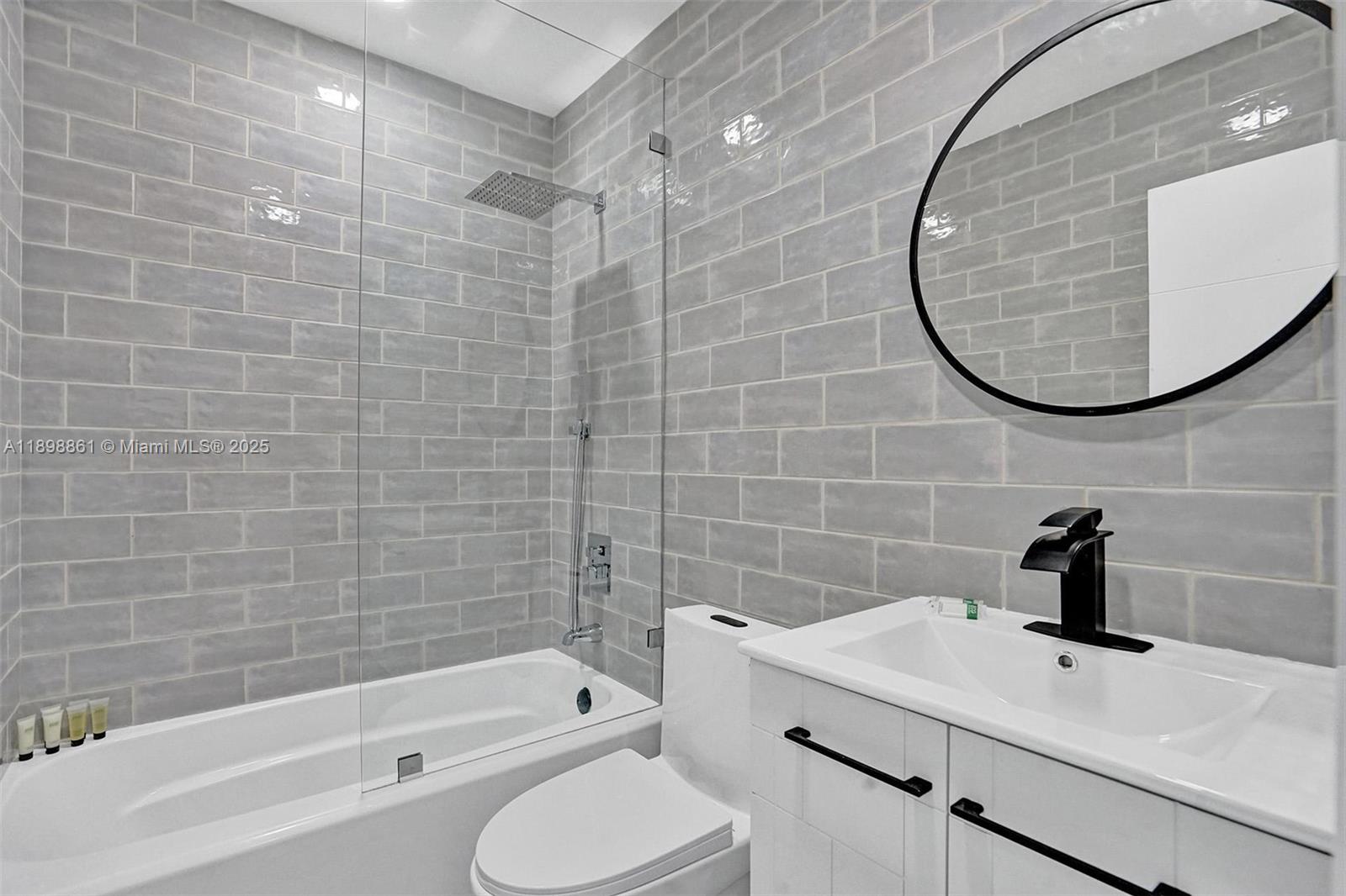 725 Harrison Street Hollywood, FL 33019 - Photo 70 of 91 a bathroom with a sink toilet and shower