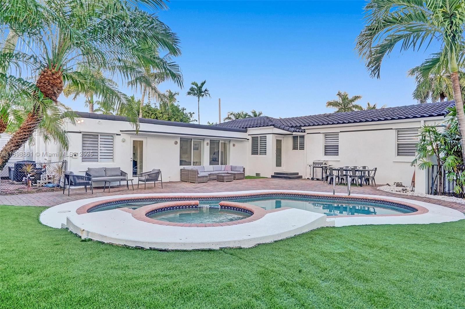 725 Harrison Street Hollywood, FL 33019 - Photo 71 of 91 a view of house with swimming pool yard and outdoor seating