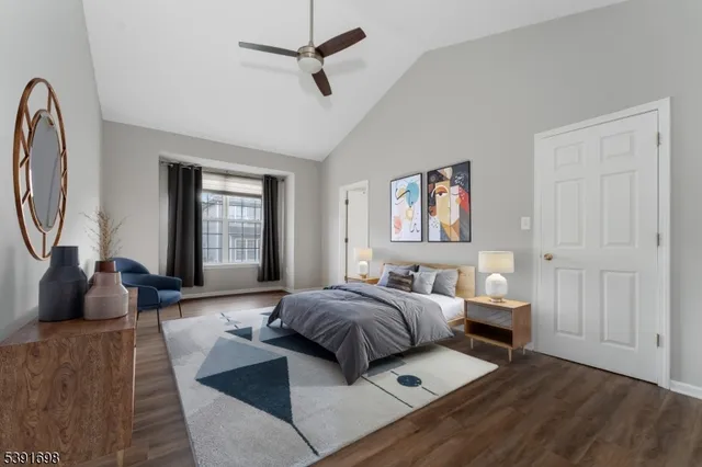 a living room with a bed furniture and a window
