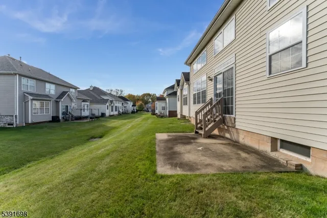 a view of a house with a back yard