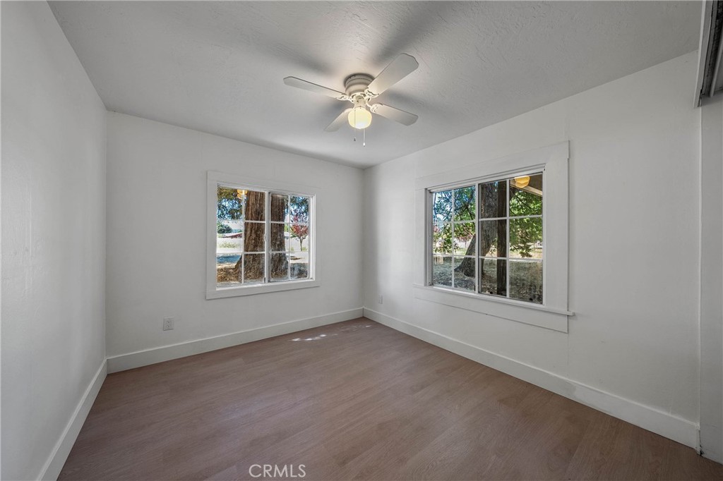 1980 Big Valley Road Lakeport, CA 95453 - Photo 13 of 56 an empty room with ceiling fan and window