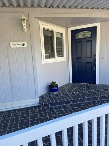 a room with a wooden door and a window