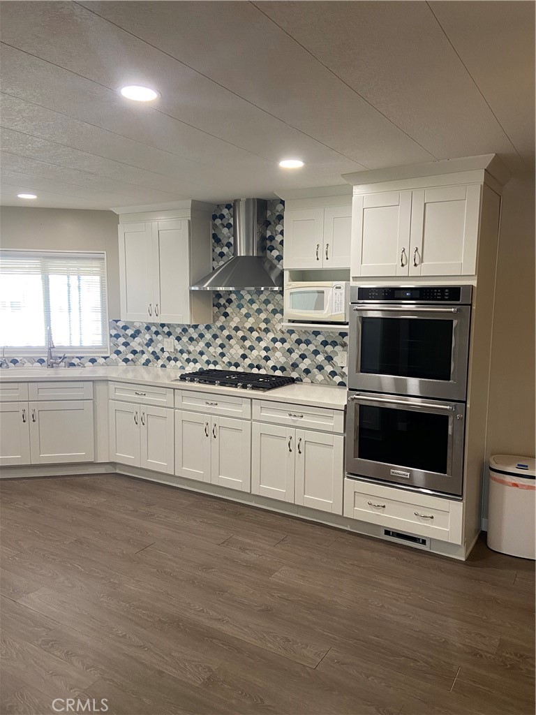 193 Rancho Adolfo Drive Camarillo, CA 93012 - Photo 11 of 43 a kitchen with stainless steel appliances granite countertop a stove a sink and a microwave