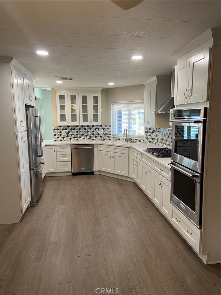 193 Rancho Adolfo Drive Camarillo, CA 93012 - Photo 12 of 43 a kitchen with a sink stove and refrigerator