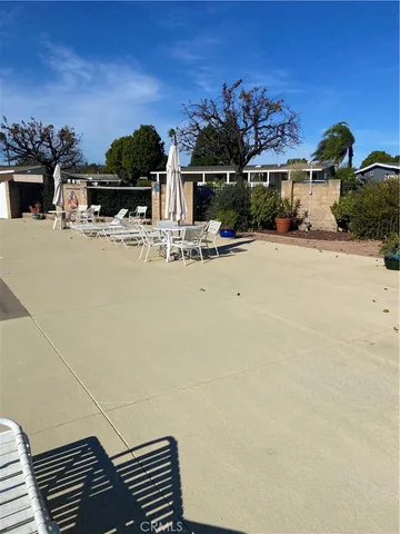 a room with lots of furniture and a chandelier