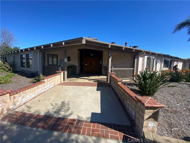a view of a livingroom with furniture and a book shelf