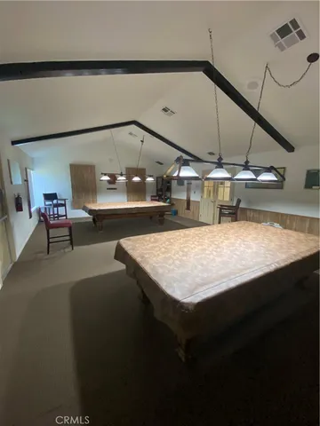 a room with gym equipment and a flat screen tv