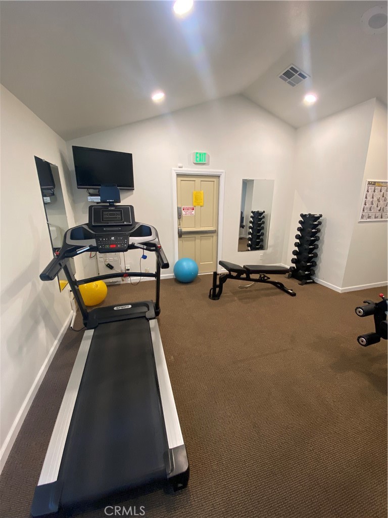 193 Rancho Adolfo Drive Camarillo, CA 93012 - Photo 43 of 43 a room with gym equipment and a flat screen tv