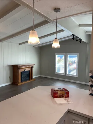 a kitchen with stainless steel appliances granite countertop a stove a sink and a wooden floors