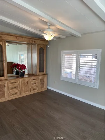 a living room with furniture and large windows