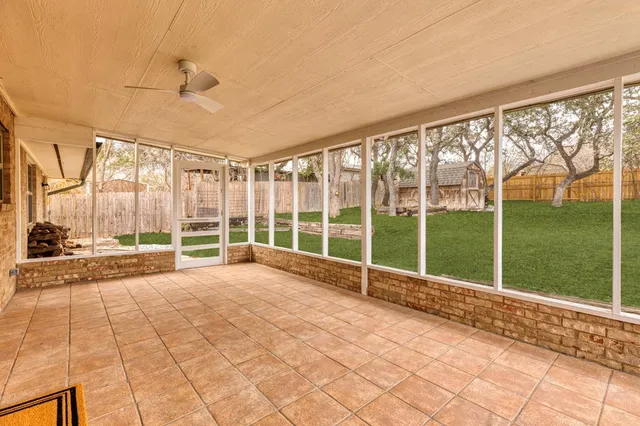 a view of an empty room with a large window