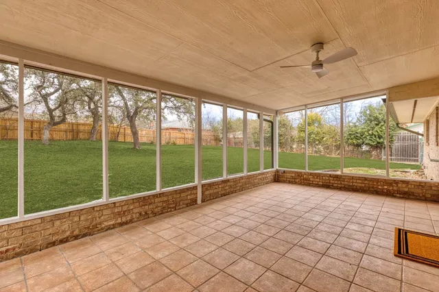 front view of a house with a yard table and chairs