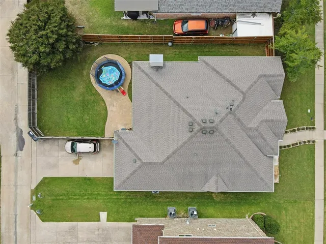 an aerial view of a house with a swimming pool