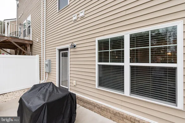a view of a house with a table and chairs