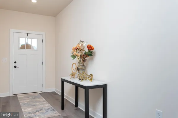 a view of a hallway with a flower pot