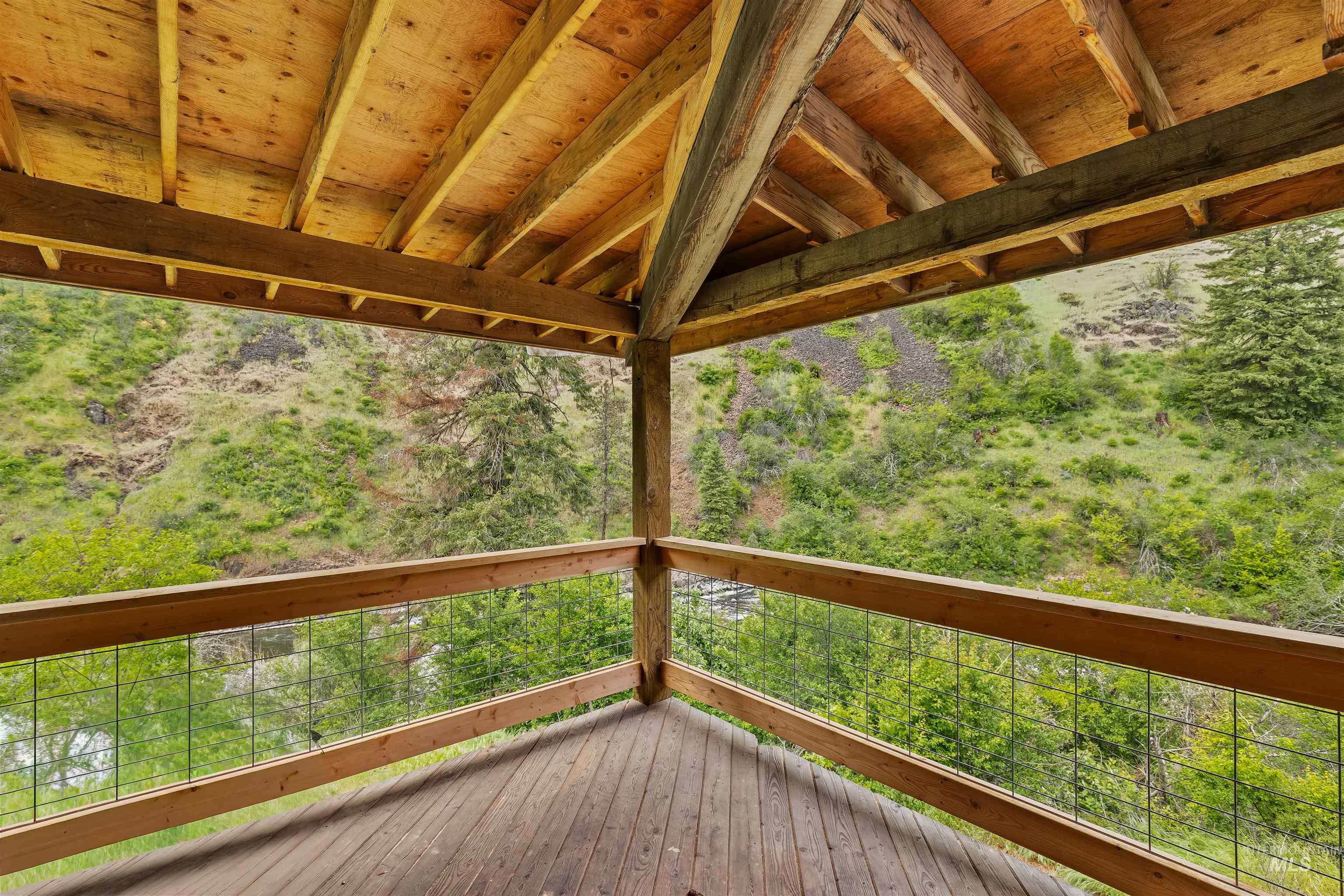 1314 Cedar Ridge Road Kendrick, ID 83537 - Photo 25 of 50 Expansive outdoor deck featuring wood-finish flooring and a natural wood railing