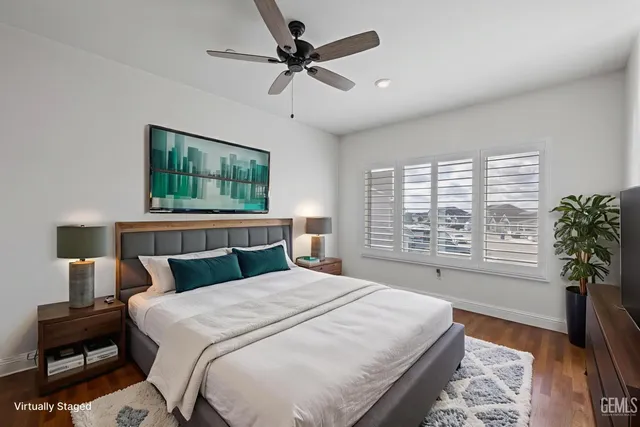 a bedroom with a large bed and a window