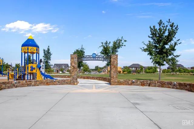 a view of a park with swings and slides