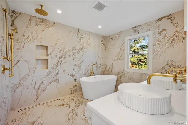 a spacious bedroom with a bed and a couch