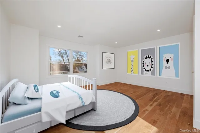 a bathroom with a granite countertop toilet sink and mirror