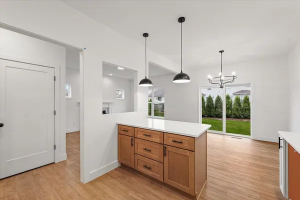 a view of a kitchen cabinets and wooden floor
