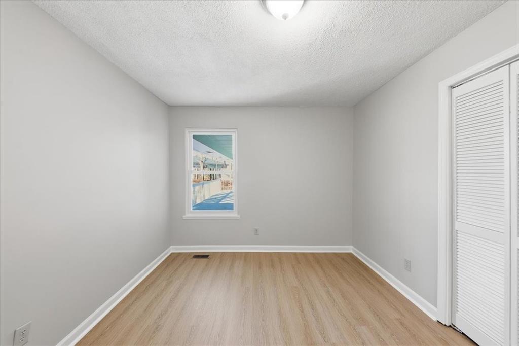 8976 Ochil Lane Winston, GA 30187 - Photo 30 of 53 an empty room with a window
