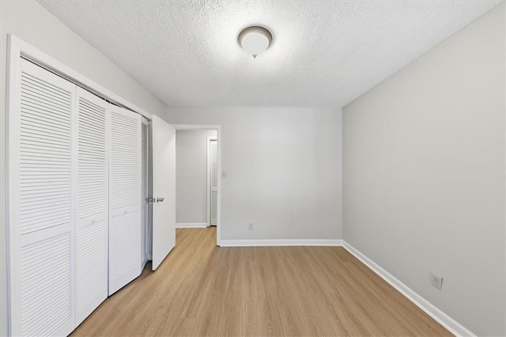 8976 Ochil Lane Winston, GA 30187 - Photo 31 of 53 a view of a room with wooden floor and a window