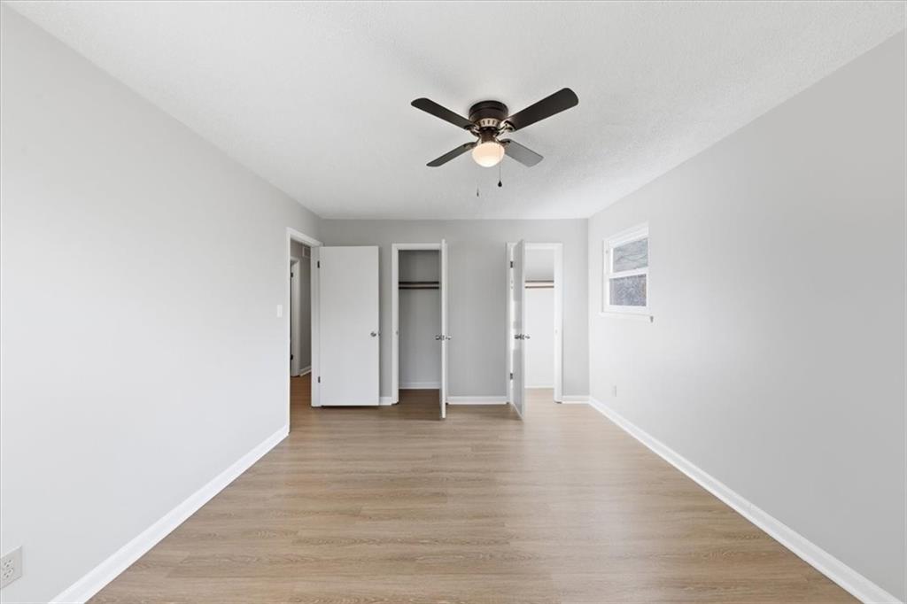 8976 Ochil Lane Winston, GA 30187 - Photo 33 of 53 a view of empty room with wooden floor