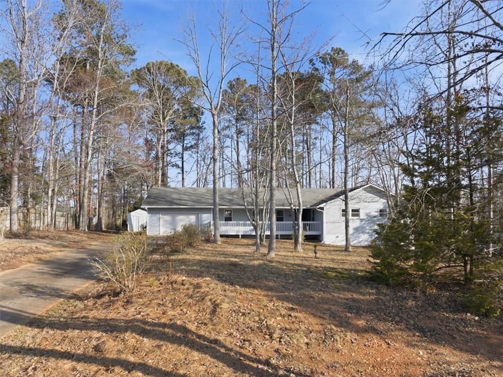 8976 Ochil Lane Winston, GA 30187 - Photo 47 of 53 a tall building with trees in front of it