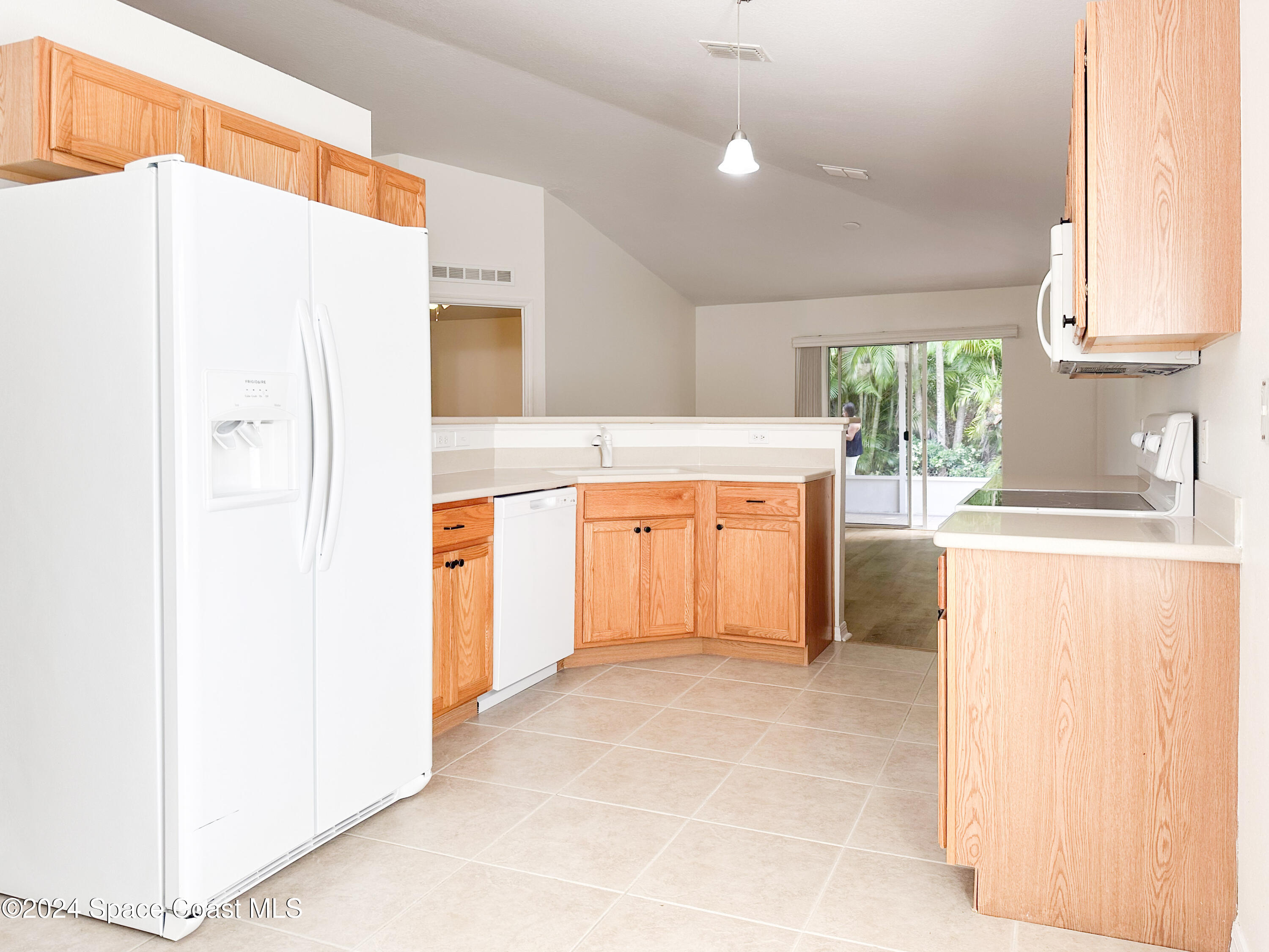 152 Morgan Circle Sebastian, FL 32958 - Photo 12 of 64 a kitchen with stainless steel appliances a refrigerator and a stove