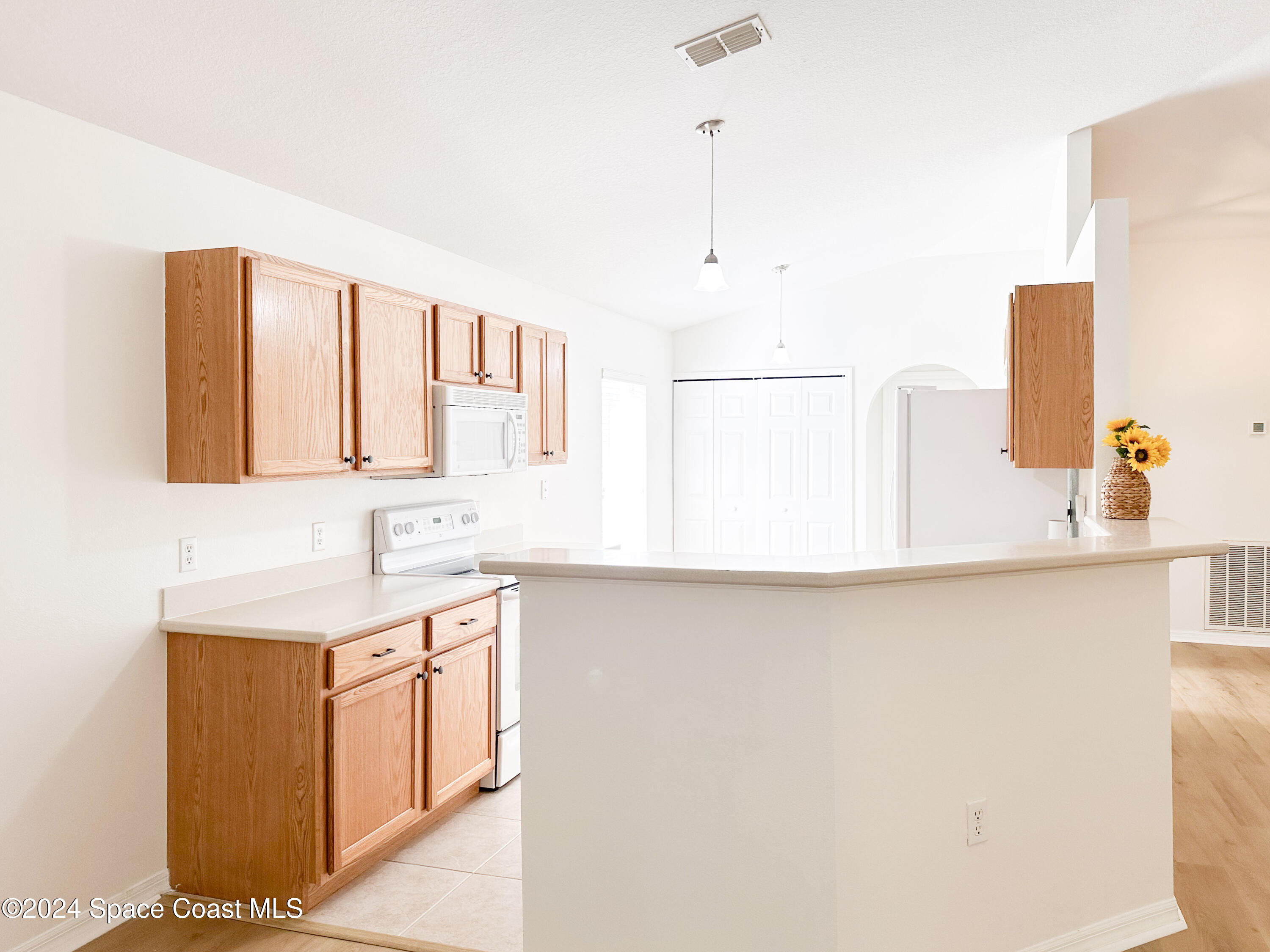 152 Morgan Circle Sebastian, FL 32958 - Photo 16 of 64 a kitchen with a sink cabinets and a window