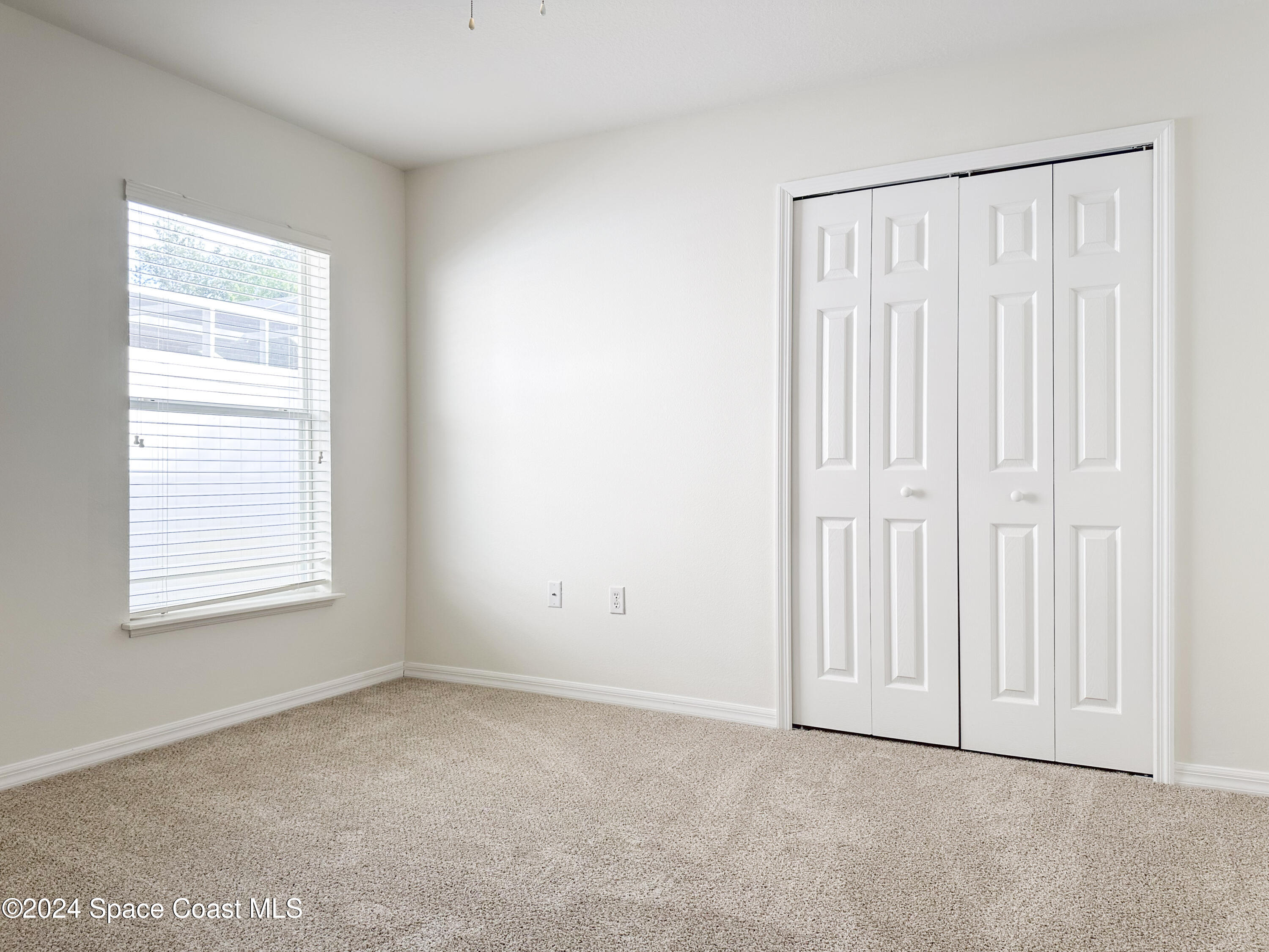152 Morgan Circle Sebastian, FL 32958 - Photo 24 of 64 an empty room with a window
