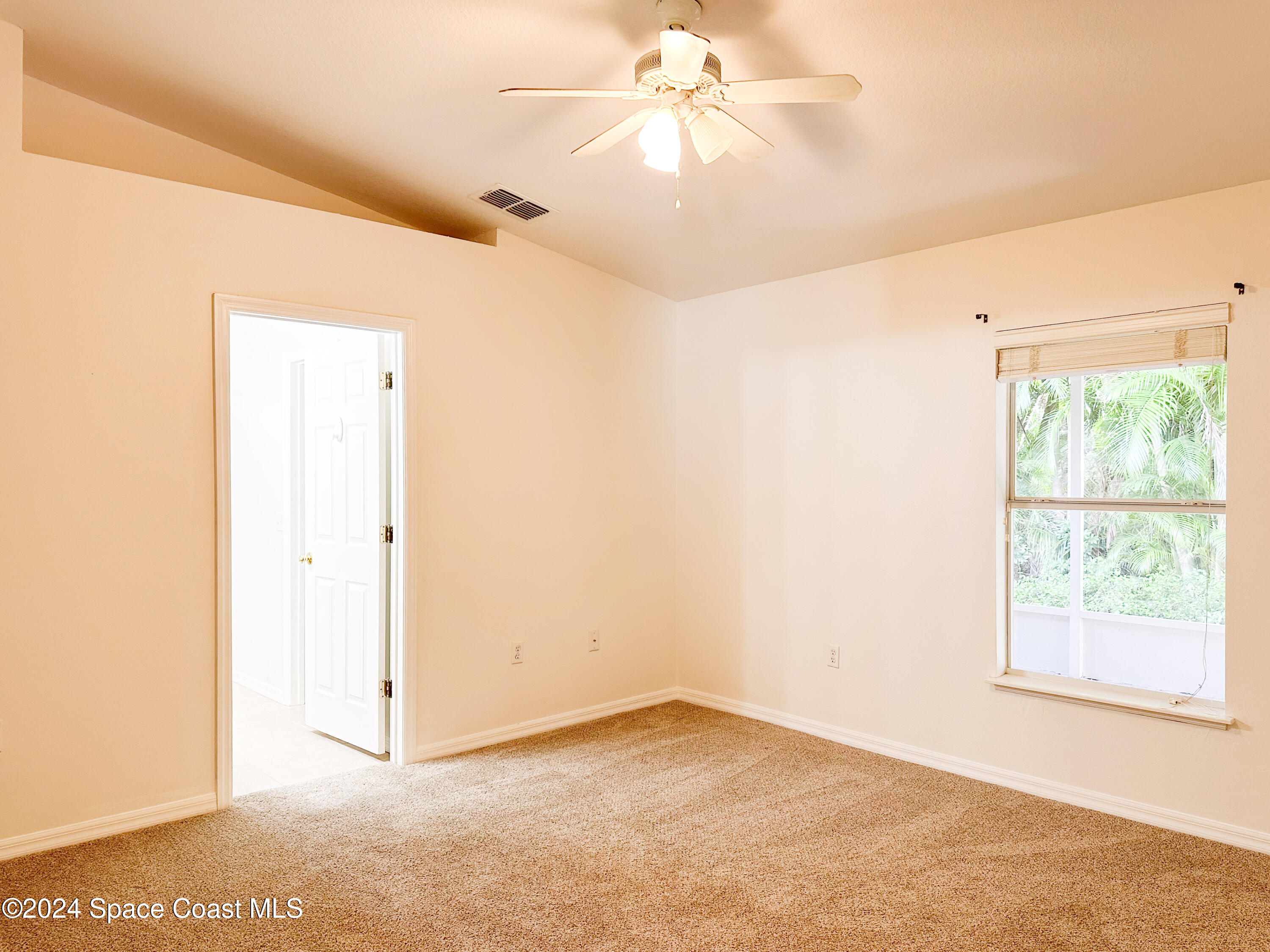 152 Morgan Circle Sebastian, FL 32958 - Photo 30 of 64 a view of an empty room with a window