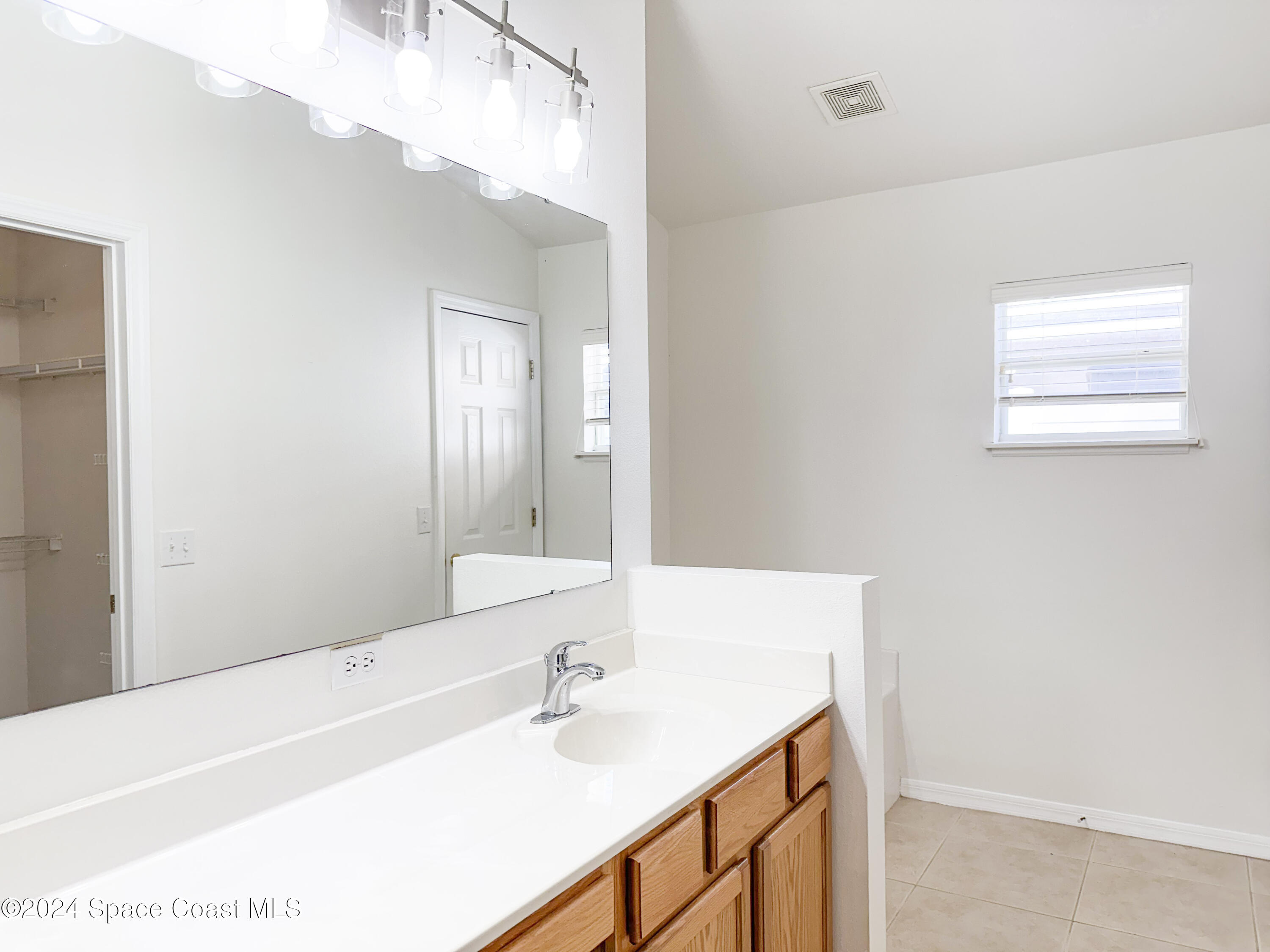 152 Morgan Circle Sebastian, FL 32958 - Photo 32 of 64 a bathroom with a sink and a mirror