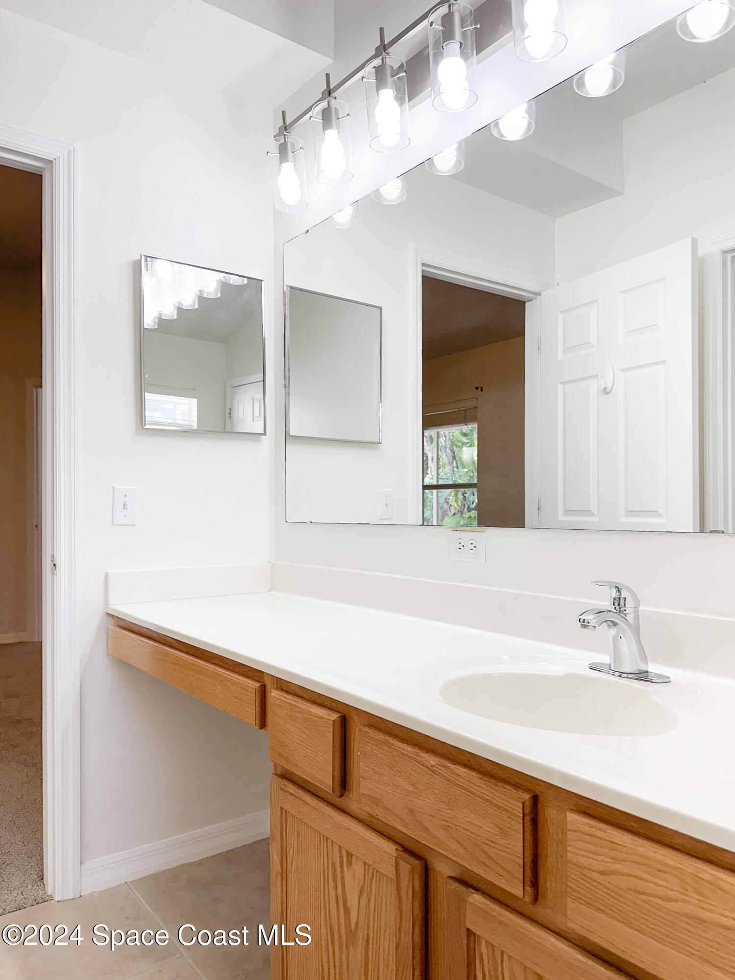 152 Morgan Circle Sebastian, FL 32958 - Photo 33 of 64 a bathroom with a sink and a mirror