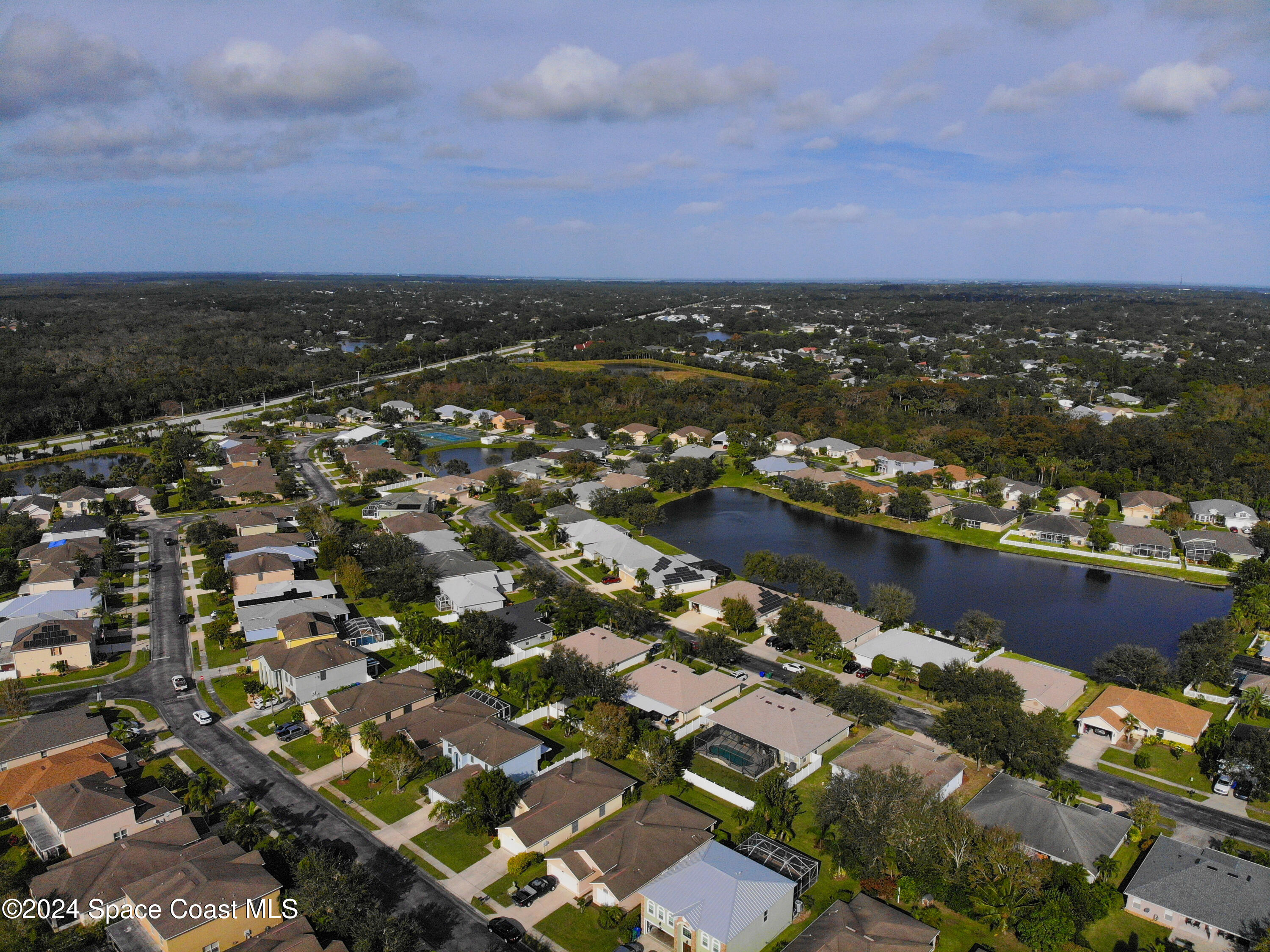 152 Morgan Circle Sebastian, FL 32958 - Photo 57 of 64 an aerial view of residential building and lake