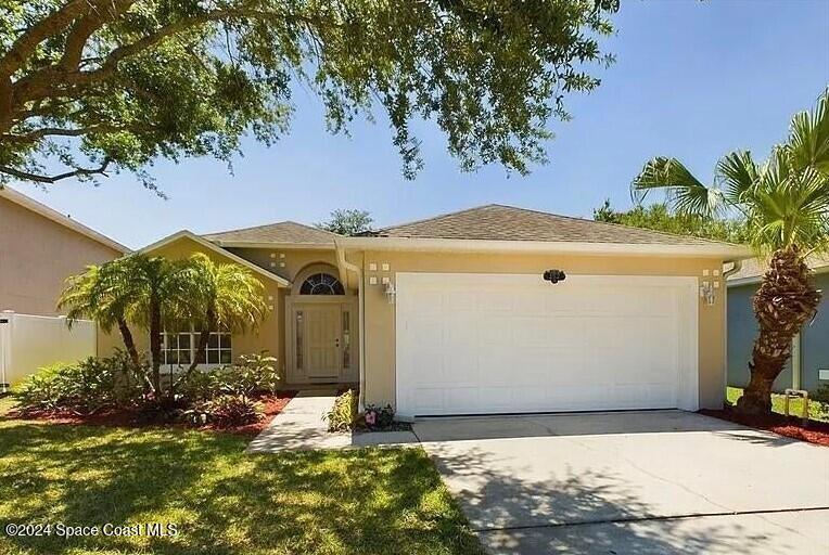 152 Morgan Circle Sebastian, FL 32958 - Photo 64 of 64 a front view of a house with a yard