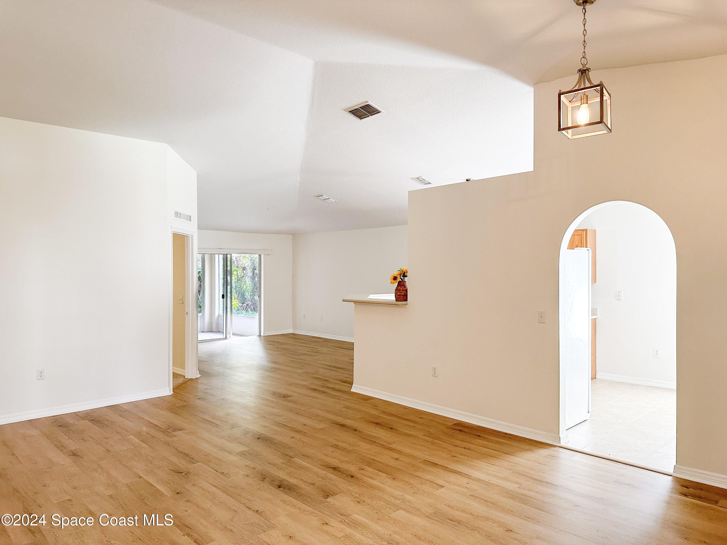 152 Morgan Circle Sebastian, FL 32958 - Photo 8 of 64 a view of livingroom with hardwood floor and hallway